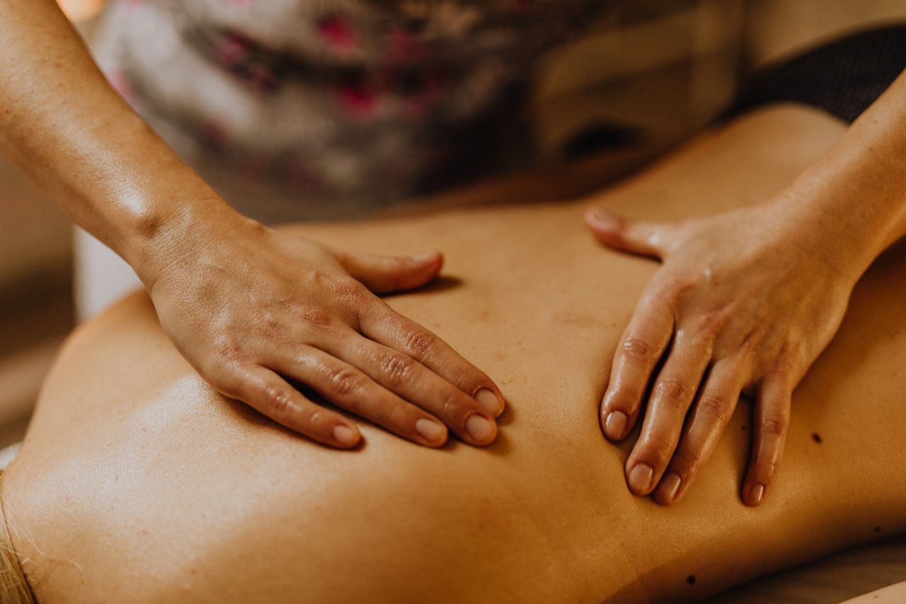 Mastering the First Impression: Your intriguing post title goes here Close-up of hands giving a soothing back massage in a calm setting.